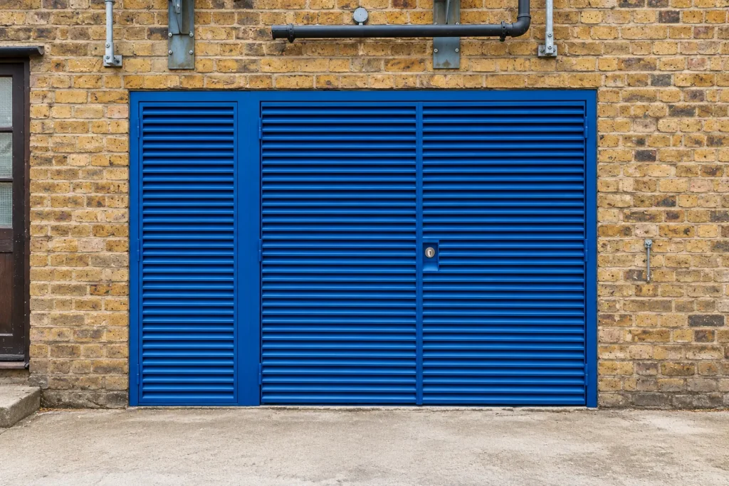 Blue Louvered Doors in London Brick